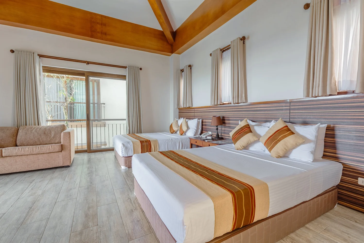 Room balcony view overlooking misty mountains and lush greenery